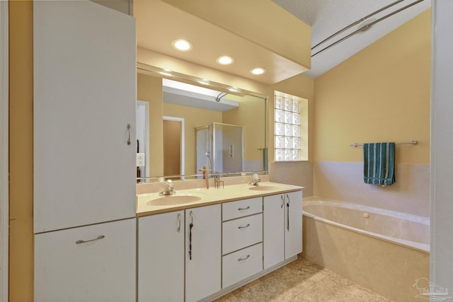 bathroom featuring vanity, tile patterned floors, and independent shower and bath