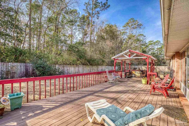 wooden deck featuring a gazebo