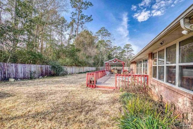 view of yard with a wooden deck and a gazebo