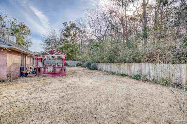 view of yard featuring a wooden deck