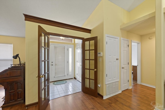 foyer with french doors and wood-type flooring