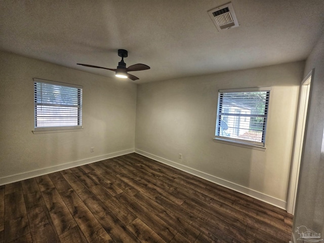 5197 Avenida Del Fuego, Pace, FL 32571 - unfurnished room featuring dark wood finished floors, healthy amount of natural light, a ceiling fan, and a textured ceiling