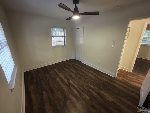 5197 Avenida Del Fuego, Pace, FL 32571 - unfurnished bedroom with multiple windows, dark wood-style floors, and a closet