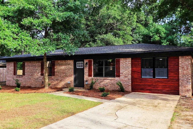 5197 Avenida Del Fuego, Pace, FL 32571 - single story home featuring brick siding, a front yard, a shingled roof, and concrete driveway