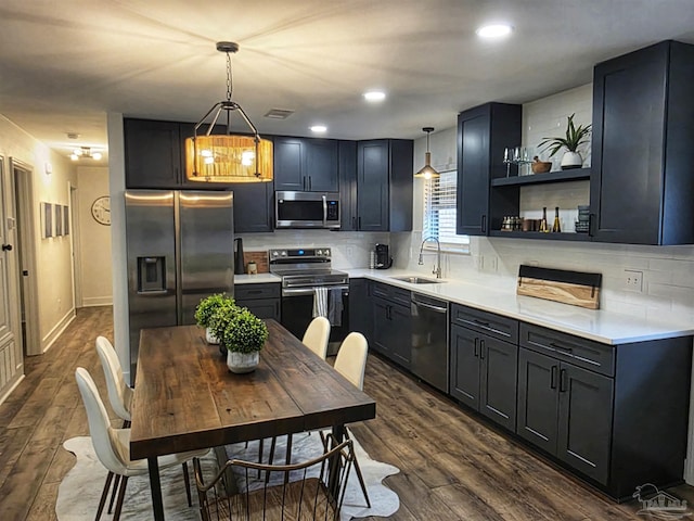 5197 Avenida Del Fuego, Pace, FL 32571 - kitchen with stainless steel appliances, dark wood-style floors, tasteful backsplash, light countertops, and recessed lighting