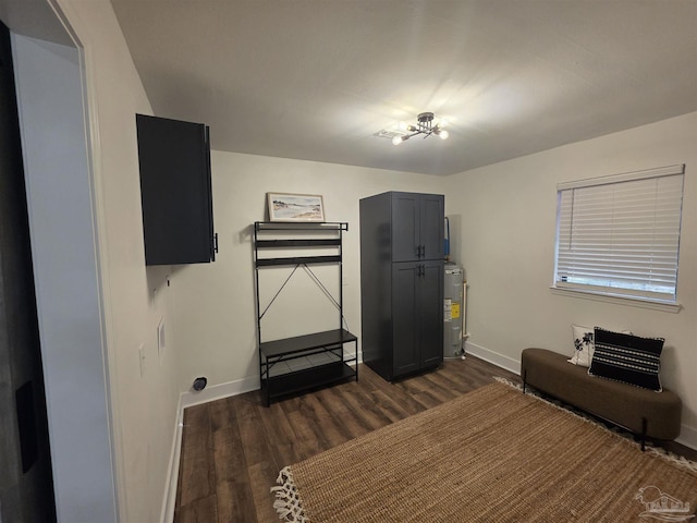 5197 Avenida Del Fuego, Pace, FL 32571 - miscellaneous room with water heater and dark wood-style flooring