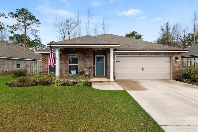 view of front of house with a shingled roof, a front lawn, concrete driveway, a garage, and brick siding