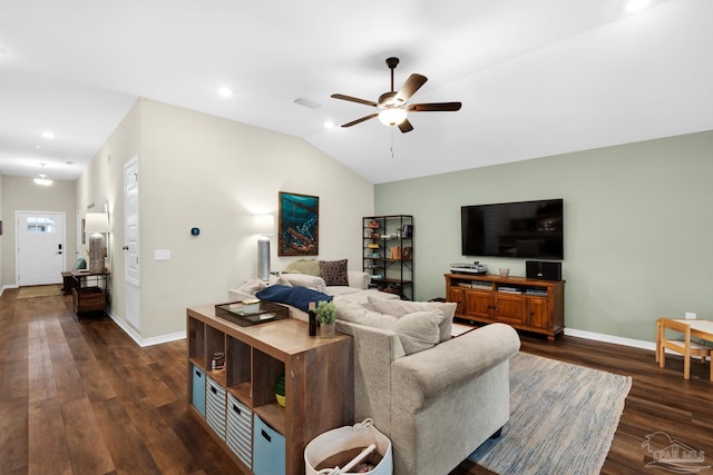 living area featuring visible vents, a ceiling fan, baseboards, dark wood-style flooring, and vaulted ceiling