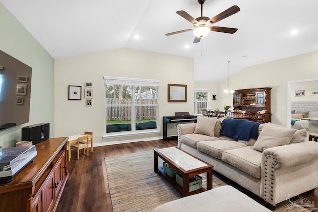 living area with dark wood-style flooring, recessed lighting, ceiling fan, and vaulted ceiling