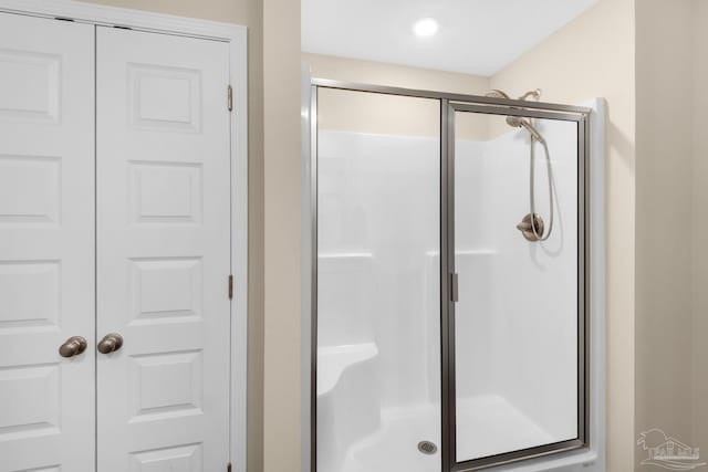 full bathroom featuring a shower stall