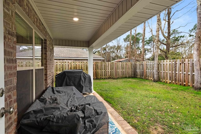 view of yard with a fenced backyard