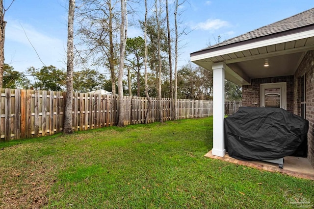 view of yard with a fenced backyard