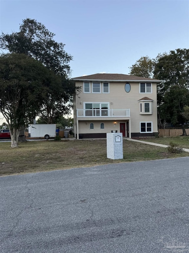 8156 Pompano St, Navarre, FL 32566 - view of front facade with a front lawn and fence