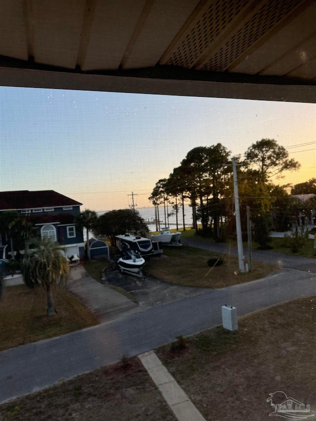 view of parking at dusk