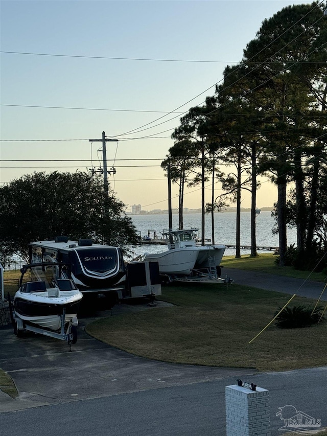 8156 Pompano St, Navarre, FL 32566 - surrounding community featuring a lawn and a water view
