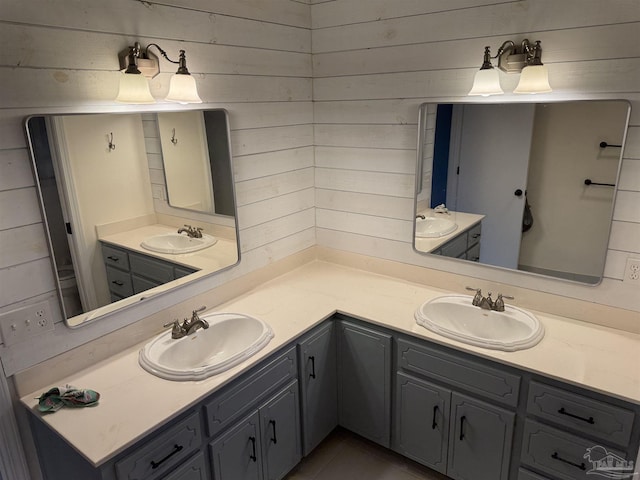 8156 Pompano St, Navarre, FL 32566 - full bathroom featuring double vanity, wood walls, and a sink