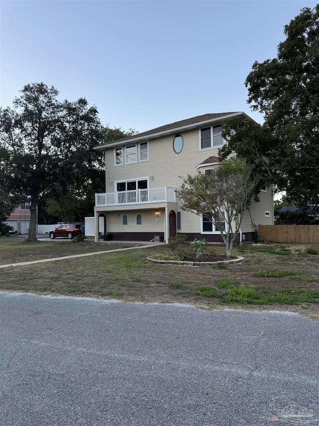 8156 Pompano St, Navarre, FL 32566 - townhome / multi-family property with fence and a balcony