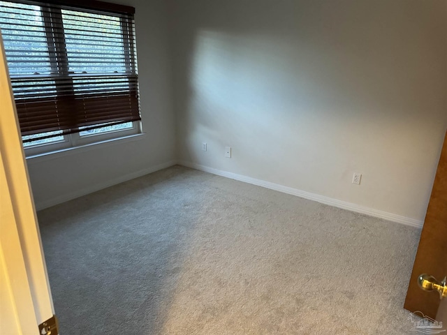 8156 Pompano St, Navarre, FL 32566 - carpeted spare room with a healthy amount of sunlight and baseboards