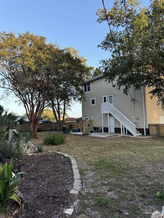 8156 Pompano St, Navarre, FL 32566 - view of yard with a fenced backyard and a patio area