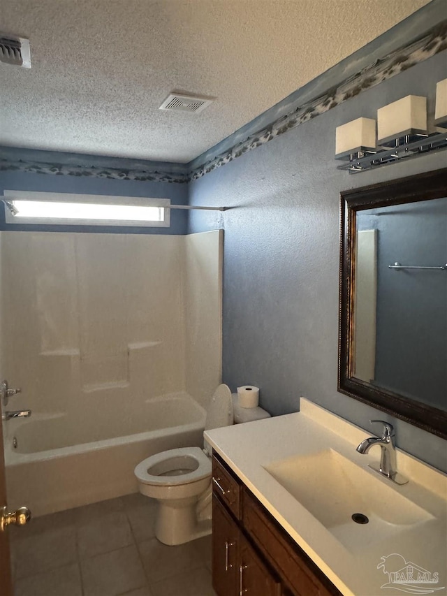 full bathroom featuring vanity, tile patterned floors, a textured ceiling, toilet, and shower / bathing tub combination