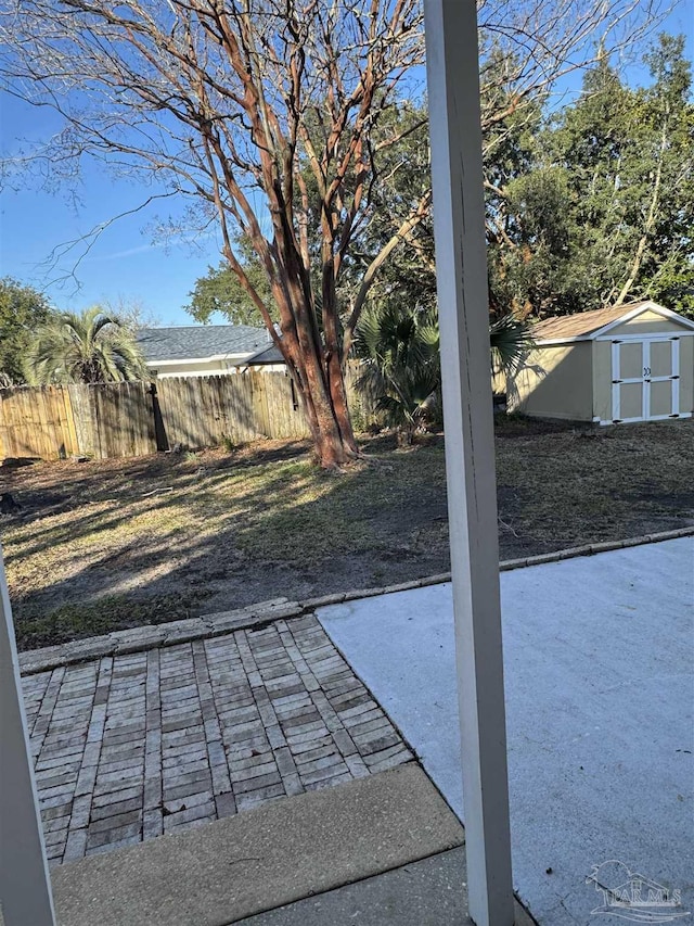 view of patio / terrace with a storage unit