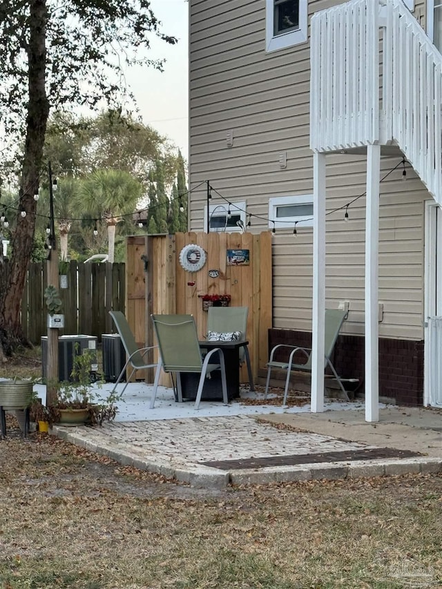 8156 Pompano St, Navarre, FL 32566 - exterior space with central AC, a patio area, and fence