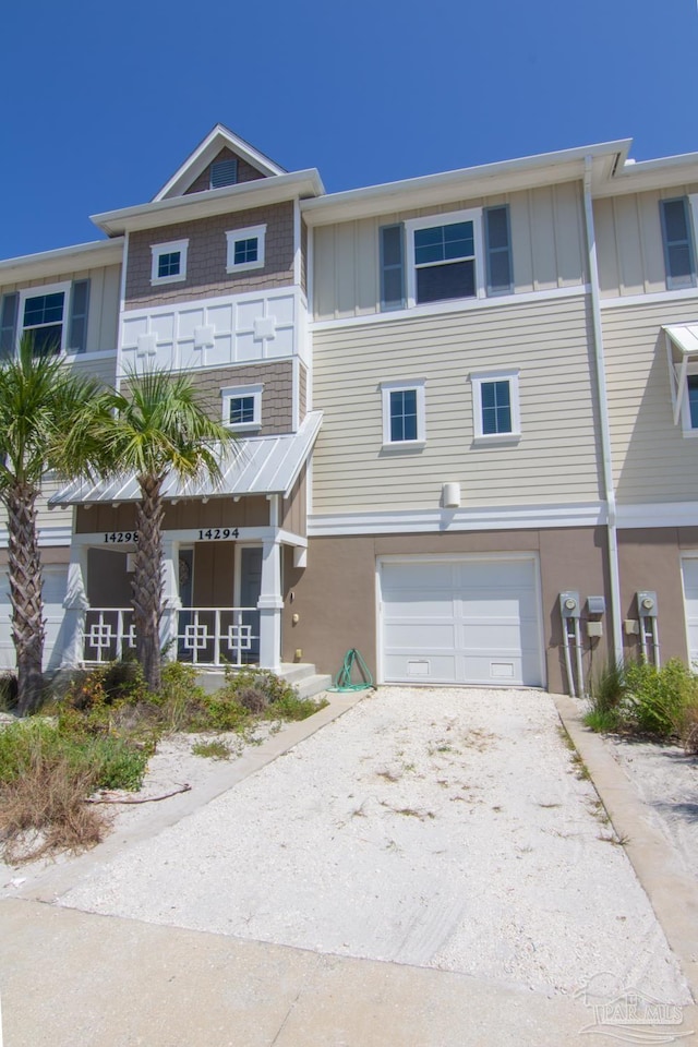 townhome / multi-family property featuring an attached garage and board and batten siding