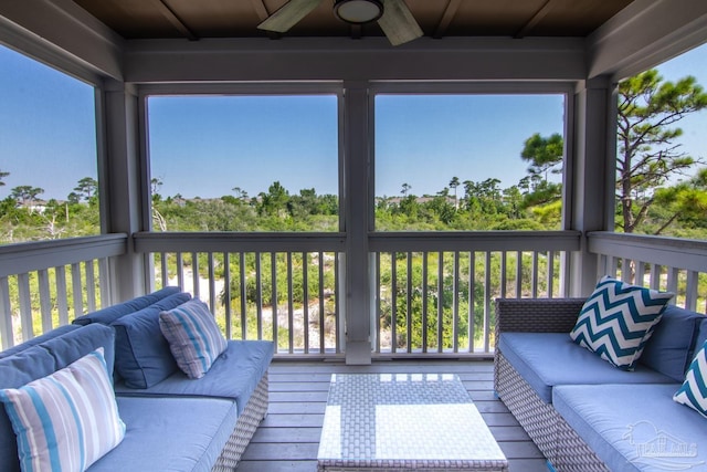 wooden terrace featuring an outdoor hangout area