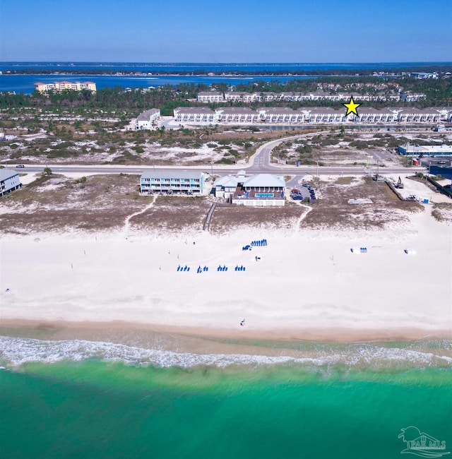 aerial view with a water view and a view of the beach