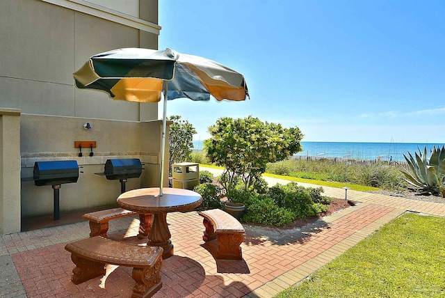 view of patio / terrace with a water view