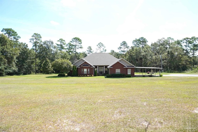 ranch-style home featuring a front yard and a carport