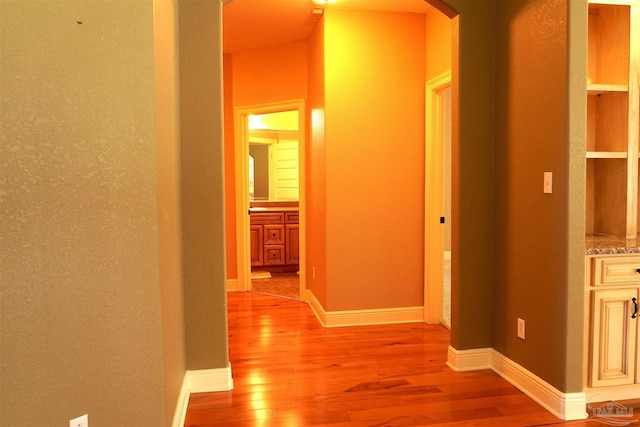 corridor with light wood-type flooring