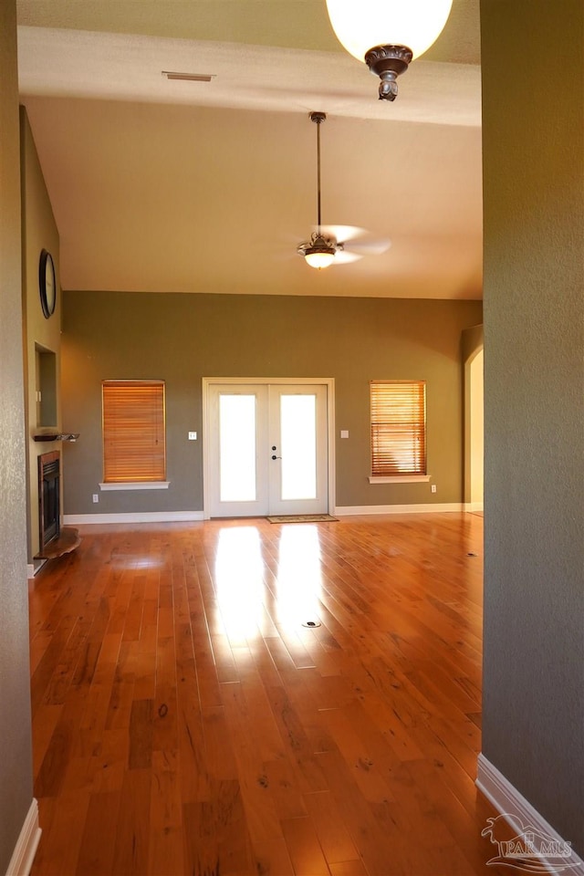 interior space with ceiling fan and hardwood / wood-style floors