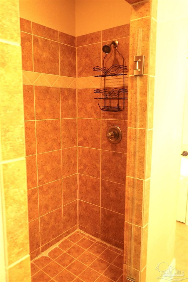 bathroom with tiled shower