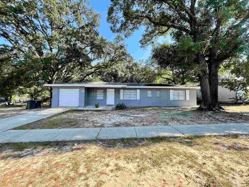 ranch-style home with a garage