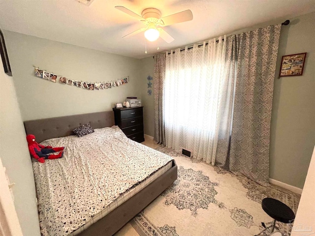 bedroom featuring ceiling fan and carpet flooring