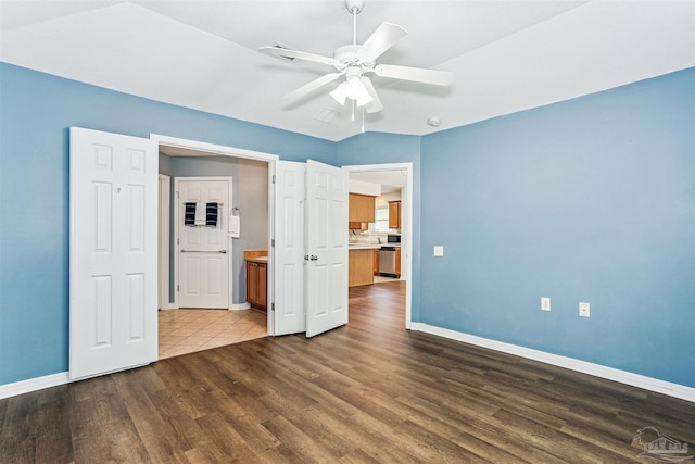5397 Fawn Ridge Dr, Gulf Breeze, FL 32563 - unfurnished bedroom featuring dark wood-style floors and a ceiling fan