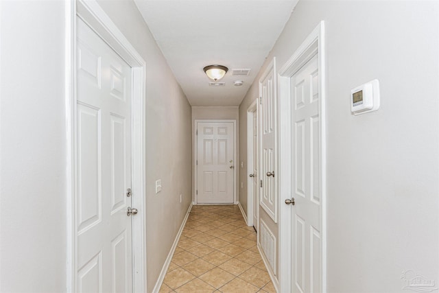 5397 Fawn Ridge Dr, Gulf Breeze, FL 32563 - corridor featuring light tile patterned flooring and baseboards