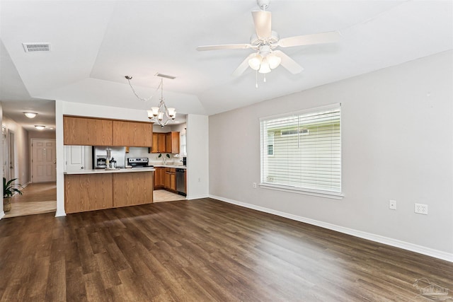 5397 Fawn Ridge Dr, Gulf Breeze, FL 32563 - kitchen featuring stainless steel appliances, brown cabinets, a chandelier, light countertops, and open floor plan