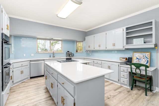kitchen featuring light wood-type flooring, a center island, appliances with stainless steel finishes, and crown molding