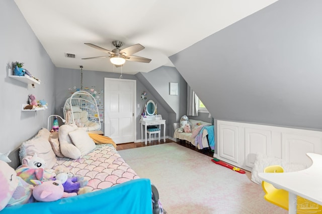 bedroom with visible vents, lofted ceiling, and a ceiling fan