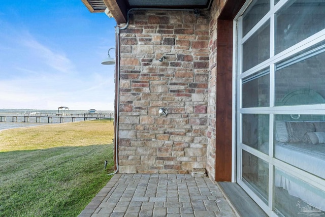5350 Pale Moon Dr, Pensacola, FL 32507 - exterior details with brick siding and a water view