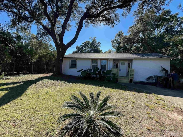 ranch-style house with a front lawn