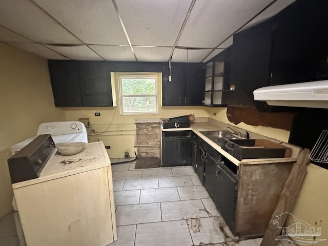 kitchen featuring washer / clothes dryer, sink, and a drop ceiling