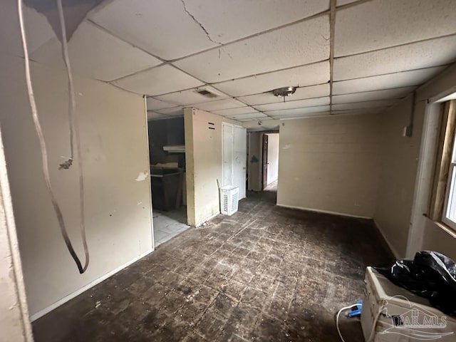 empty room with a drop ceiling