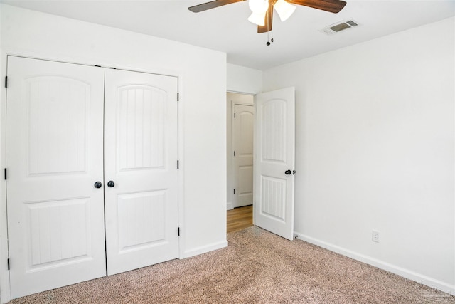 4248 Seaport Rd, Pace, FL 32571 - unfurnished bedroom featuring light carpet, a closet, baseboards, and ceiling fan