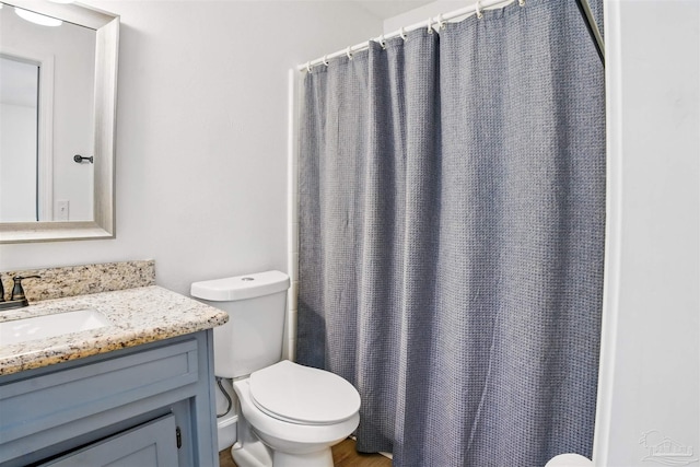 4248 Seaport Rd, Pace, FL 32571 - bathroom with vanity, toilet, and a shower with shower curtain