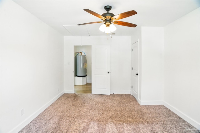 4248 Seaport Rd, Pace, FL 32571 - carpeted empty room with attic access, electric water heater, a ceiling fan, and baseboards