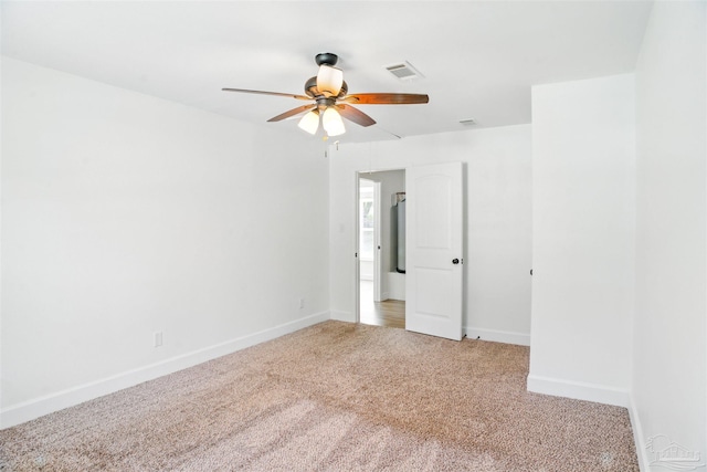 4248 Seaport Rd, Pace, FL 32571 - spare room with a ceiling fan, light colored carpet, and baseboards