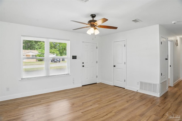 4248 Seaport Rd, Pace, FL 32571 - unfurnished room with a ceiling fan, light wood-style flooring, and baseboards
